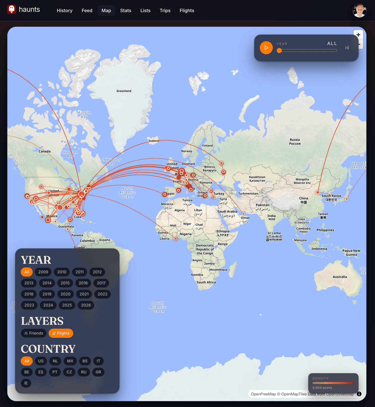 Haunts.io world atlas with great-circle flight arcs across the globe